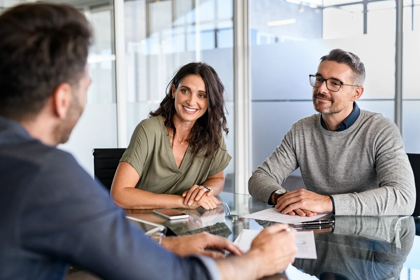 A couple meeting with their financial advisor to talk through goals and priorities